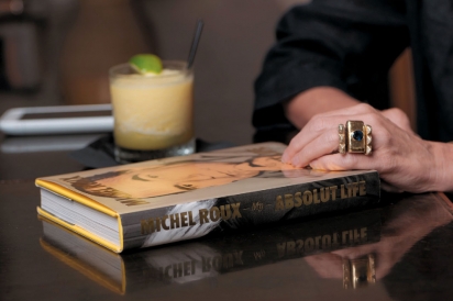 Book and cocktail on the table